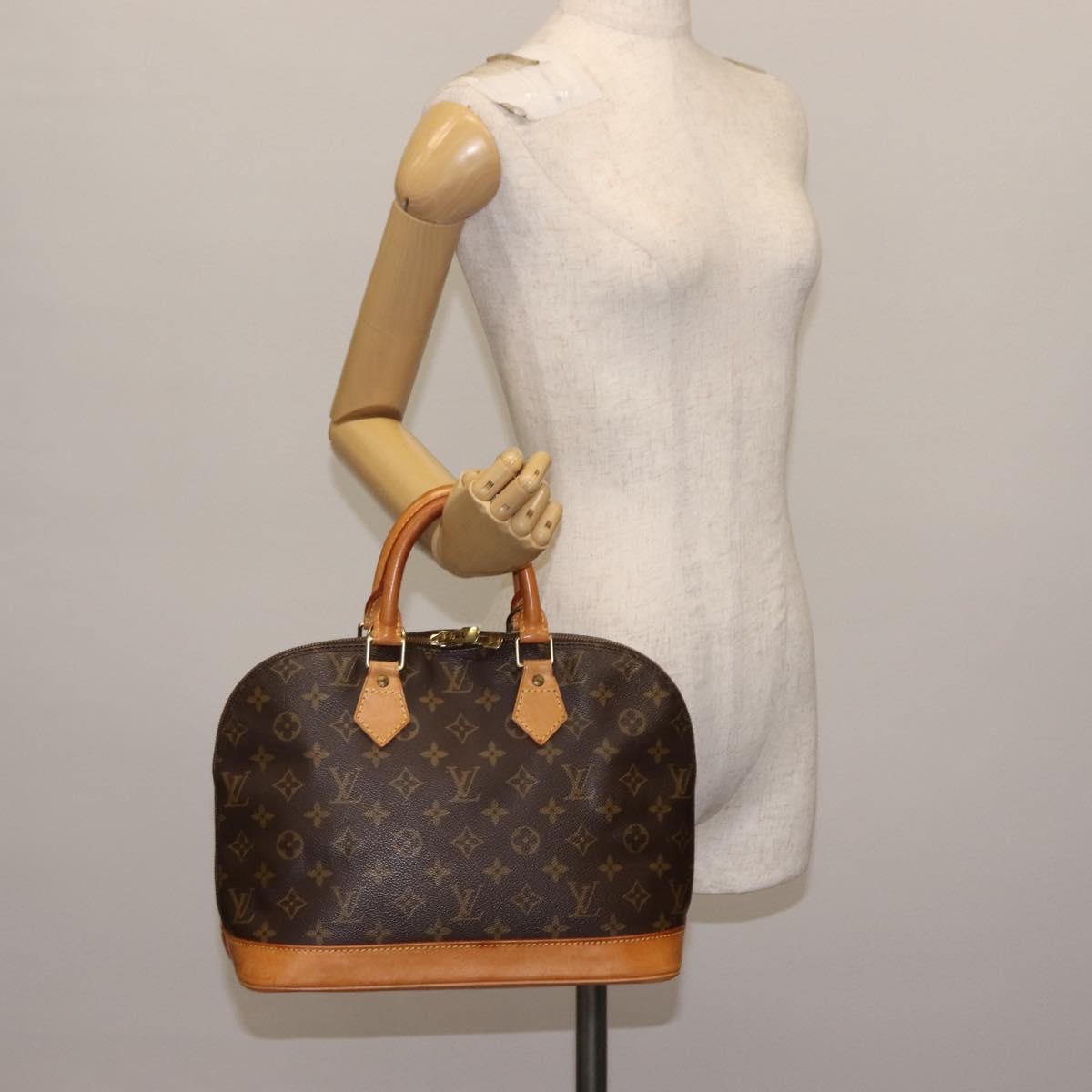 Louis Vuitton Alma Handbag Monogram Canvas Brown Canvas Handbag