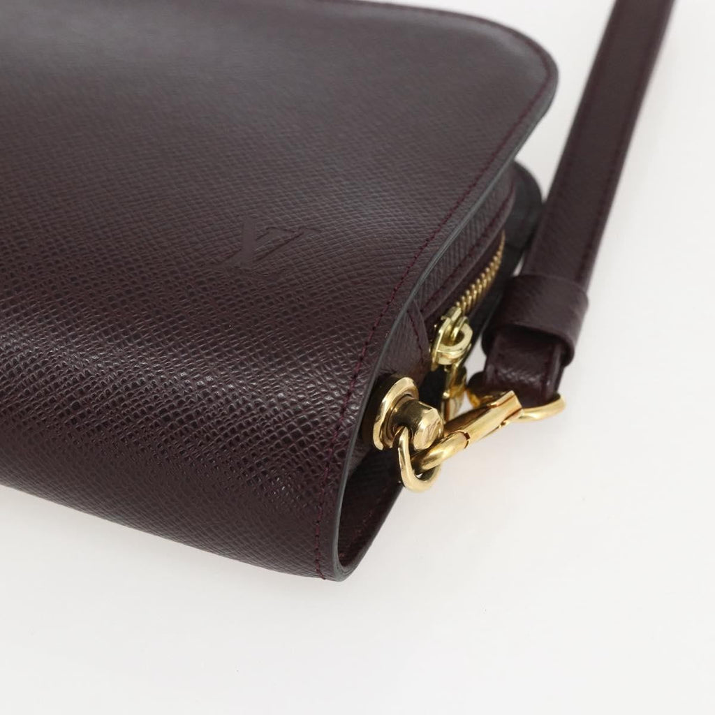 Louis Vuitton Pochette Baikal Clutch Taiga Leather Brown Leather Clutche & Pouche Bag