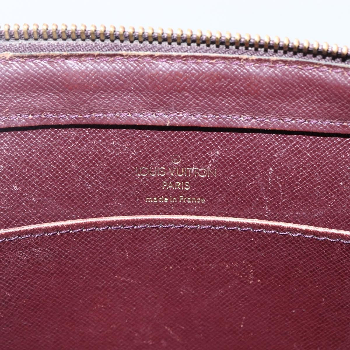 Louis Vuitton Pochette Baikal Clutch Taiga Leather Burgundy Leather Clutche & Pouche Bag