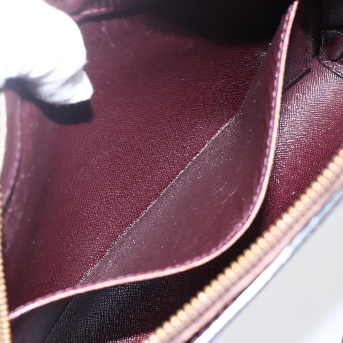 Louis Vuitton Pochette Baikal Clutch Taiga Leather Burgundy Leather Clutche & Pouche Bag